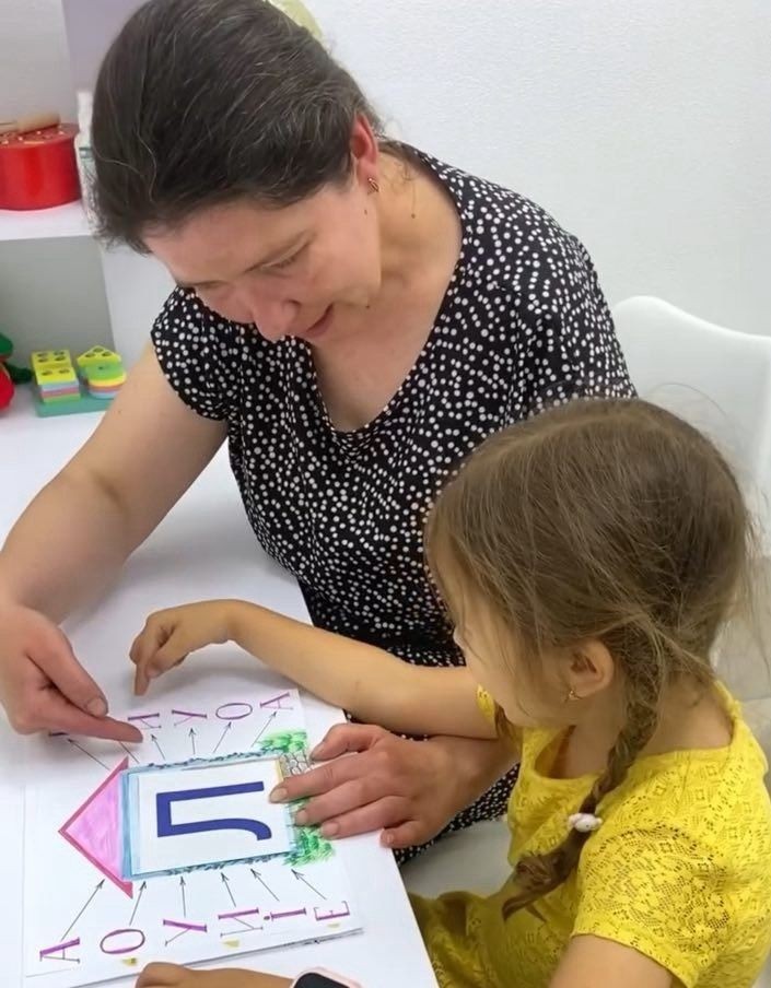 Preschool teacher with children